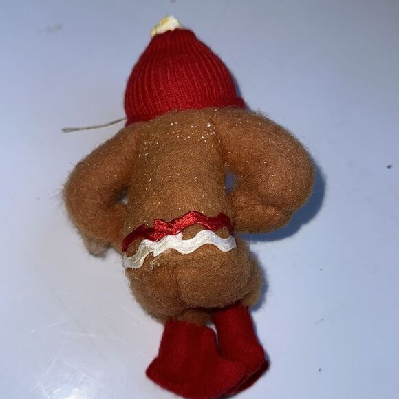 Vintage bendable smiling fuzzy gingerbread man ornament with red cap - Picture 4 of 10